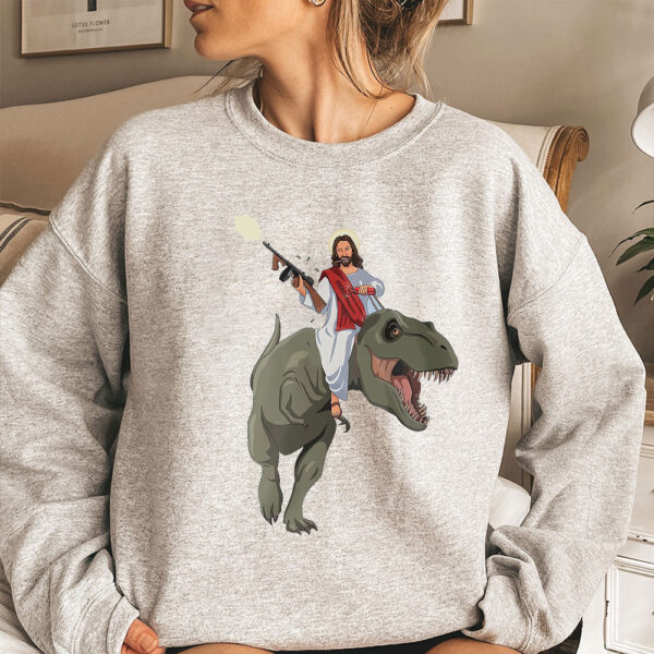 jesus riding a dinosaur sweater